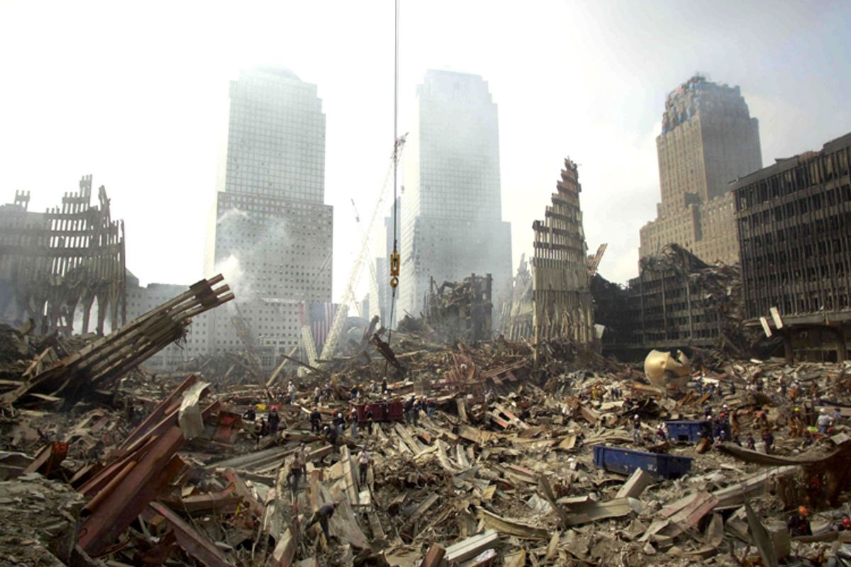 Rescue workers sift through debris at the scene of what was once the
plaza area of the World Trade Center twin towers, Sept. 24, 2001.     (Reuters)