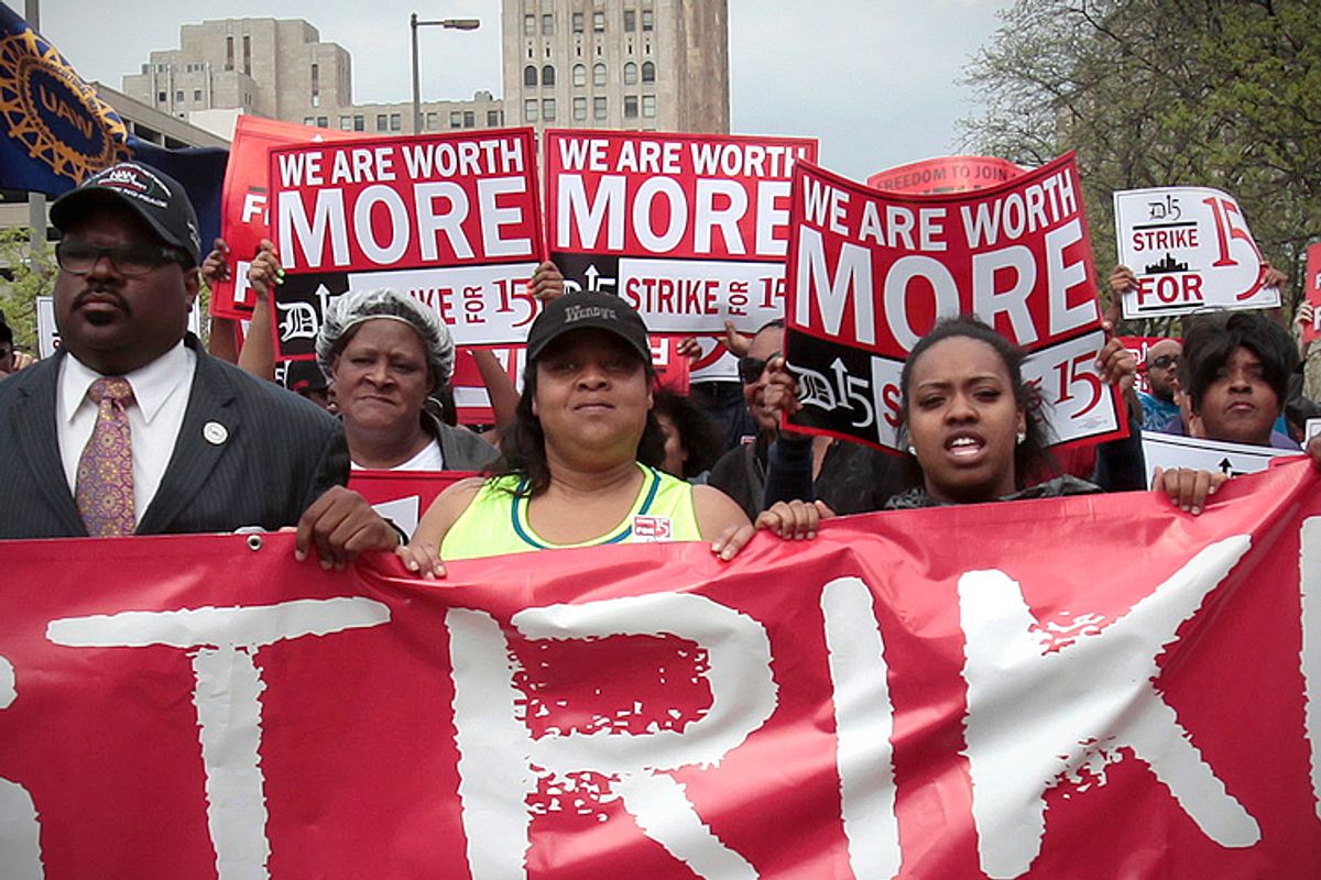 Workers and labor activists march for a higher minimum wage for fast food workers in Detroit, May 2013. (Reuters/Rebecca Cook)