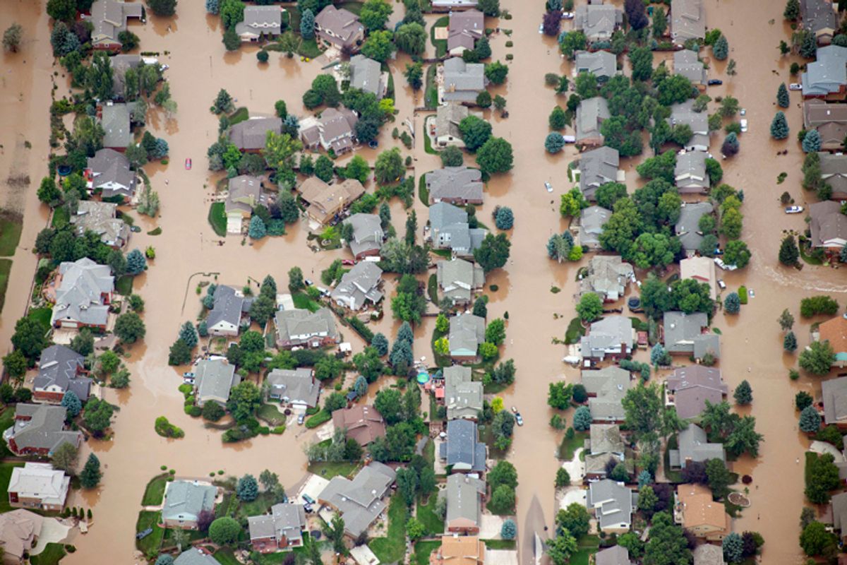 Homes in residential neighborhood in Longmont, Colo., are submerged as flooding continues to devastate the Front Range and thousands are forced to evacuate with an unconfirmed number of structures destroyed, Friday, Sept. 13, 2013.    (AP/John Wark)