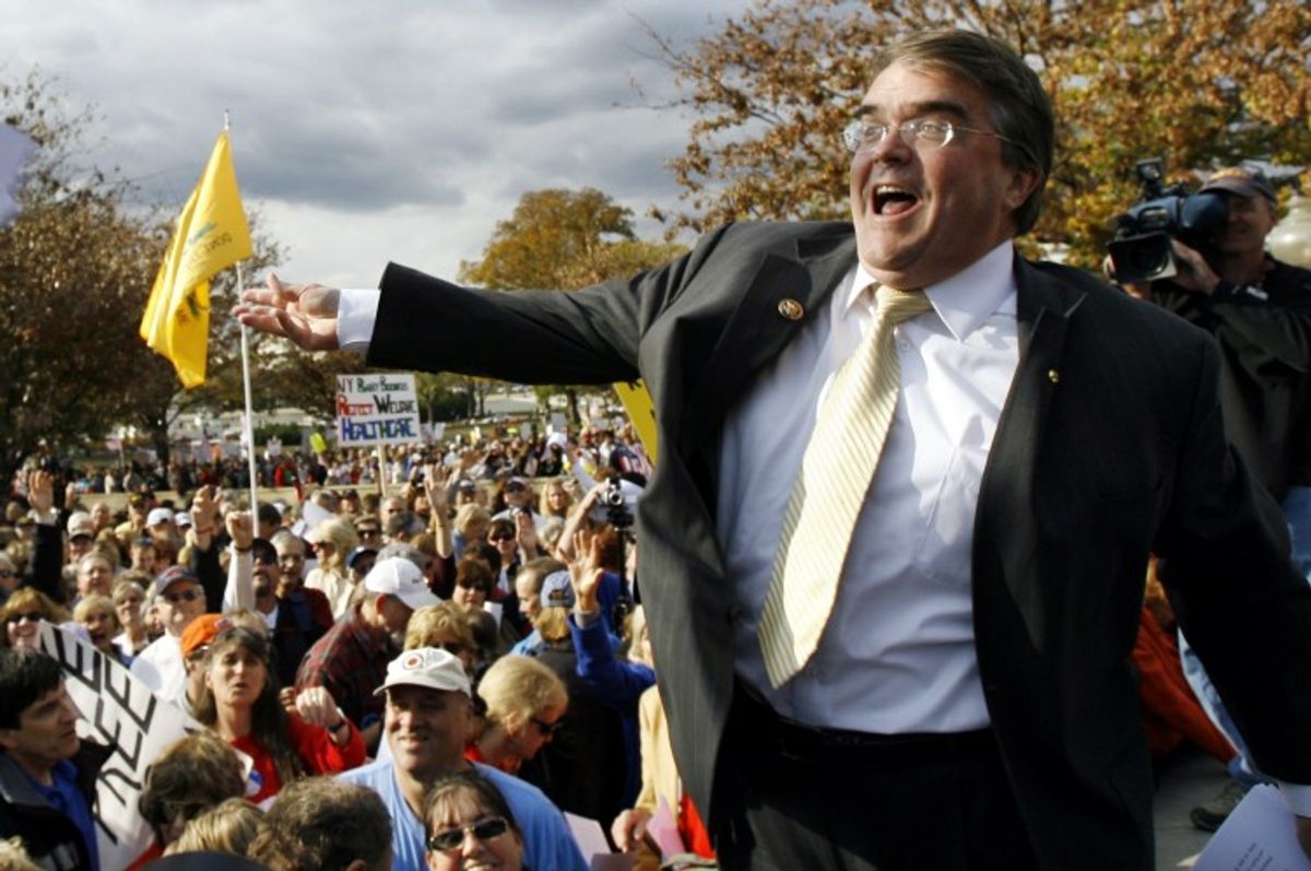 FILE - In this Nov. 5, 2009, file photo Rep. John Culberson, R-Texas, flings a  copy of the health care bill out into the crowd during a health care reform rally on Capitol hill in Washington.  (AP Photo/Jose Luis Magana, File)     (Associated Press)