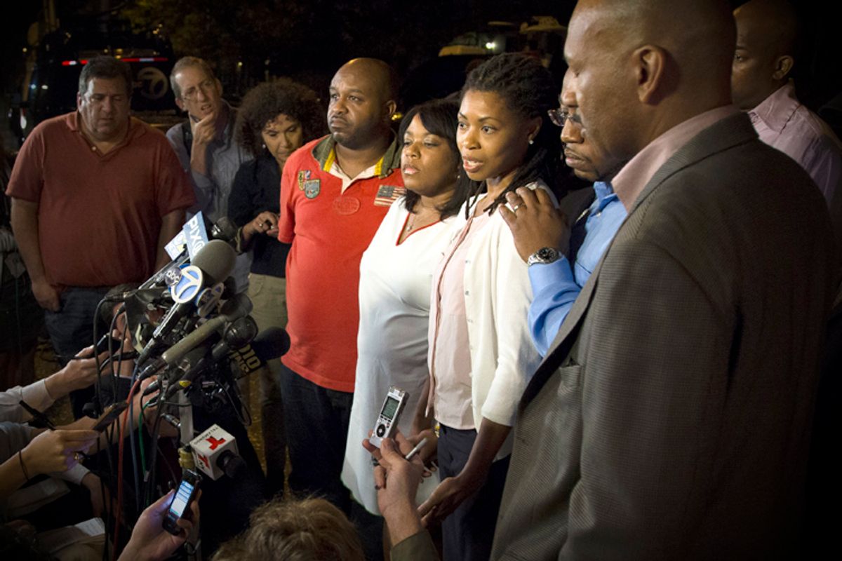 Amy Carey, fifth from right, sister of Miriam Carey, speaks outside the home of her sister Valarie in the Brooklyn, Oct. 4, 2013.   (AP/John Minchillo)