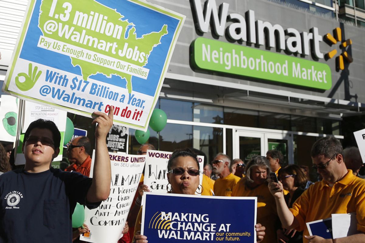 Protesters gather outside a Wal-Mart Neighborhood Store for a peaceful demonstration Thursday, Sept. 5, 2013, in Chicago.                                   (AP/Charles Rex Arbogast)