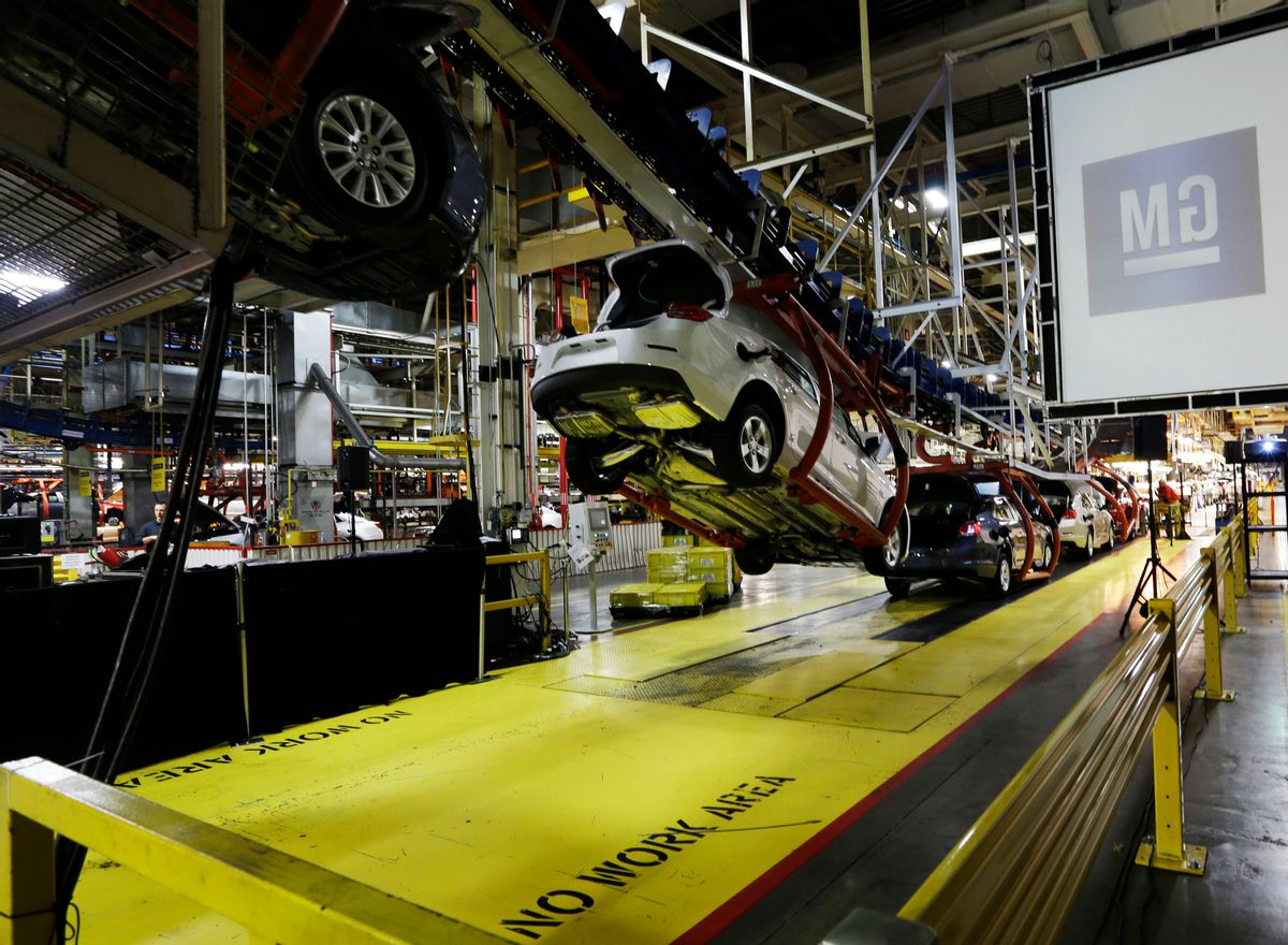 Cars move along an assembly line at the General Motors Fairfax plant in Kansas City, Kan.    (Associated Press)