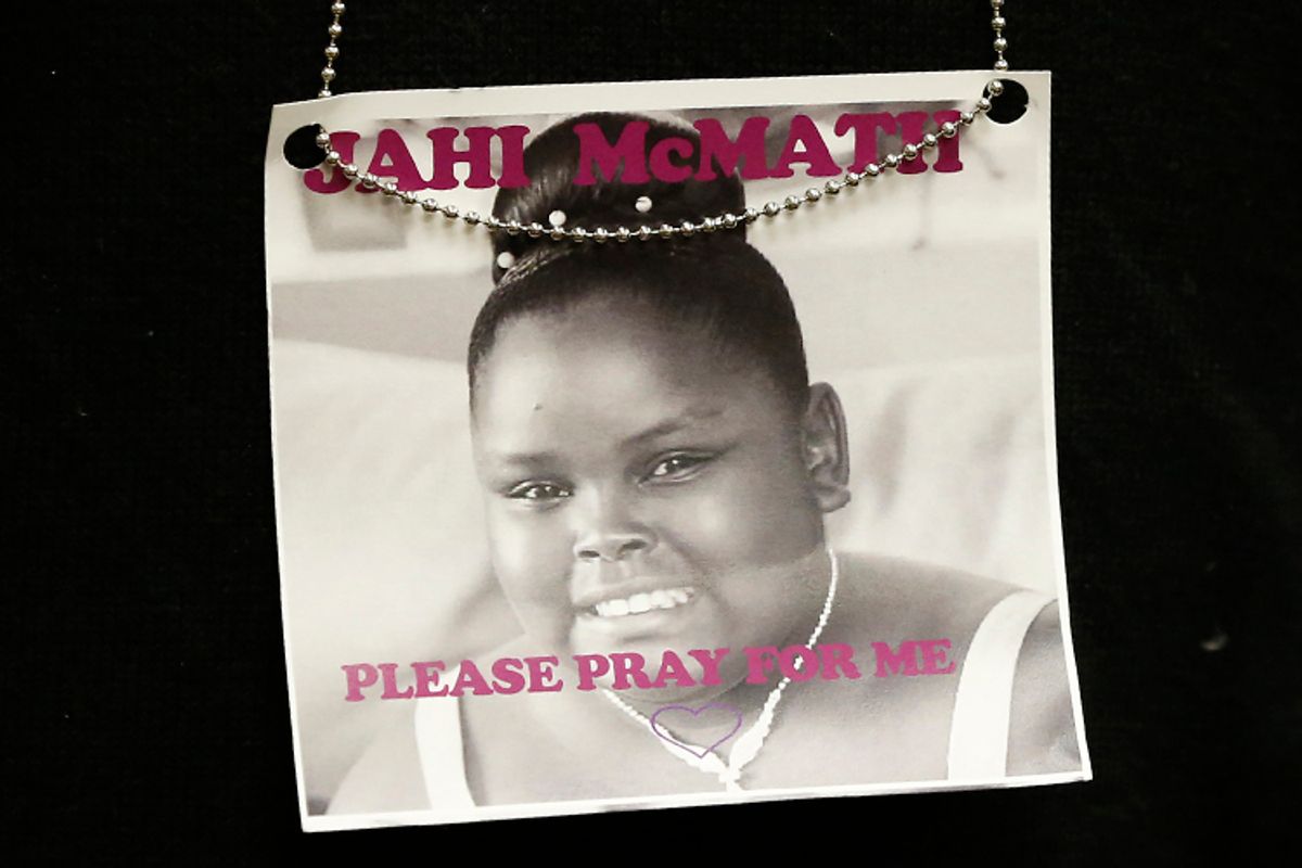 A photograph of 13-year-old Jahi McMath is seen on a necklace in Oakland, California December 24, 2013.      (Reuters/Stephen Lam)