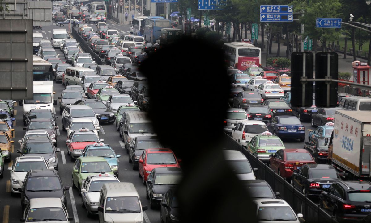 A street becomes clogged with traffic in Shanghai, China, Wednesday, May 29, 2013. With more than 13 million cars sold in China last year, motor vehicles have emerged as the chief culprit for the throat-choking air pollution in big cities. (AP Photo/Eugene Hoshiko) (Eugene Hoshiko)