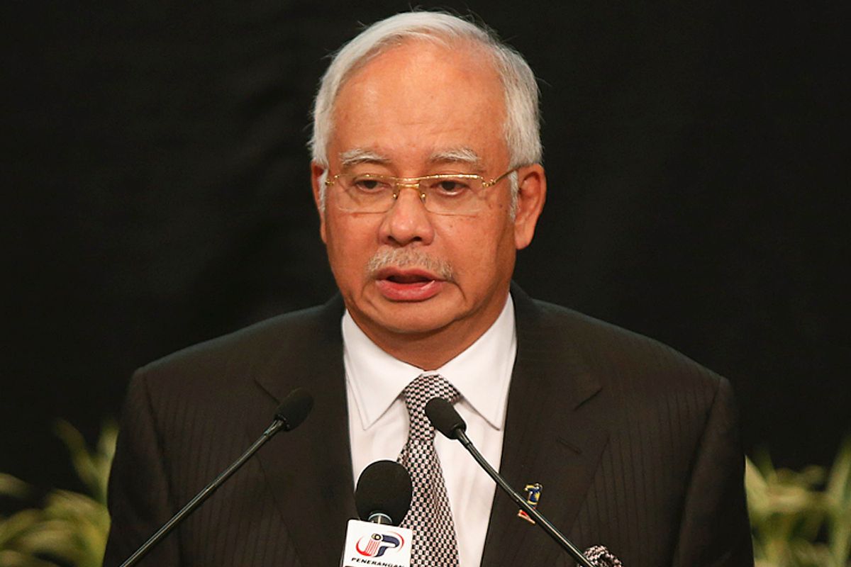 Malaysia's Prime Minister Najib Razak makes an announcement on the latest development on the missing Malaysia Airlines MH370 plane at Putra World Trade Center in Kuala Lumpur March 24, 2014.      (Reuters/Edgar Su)