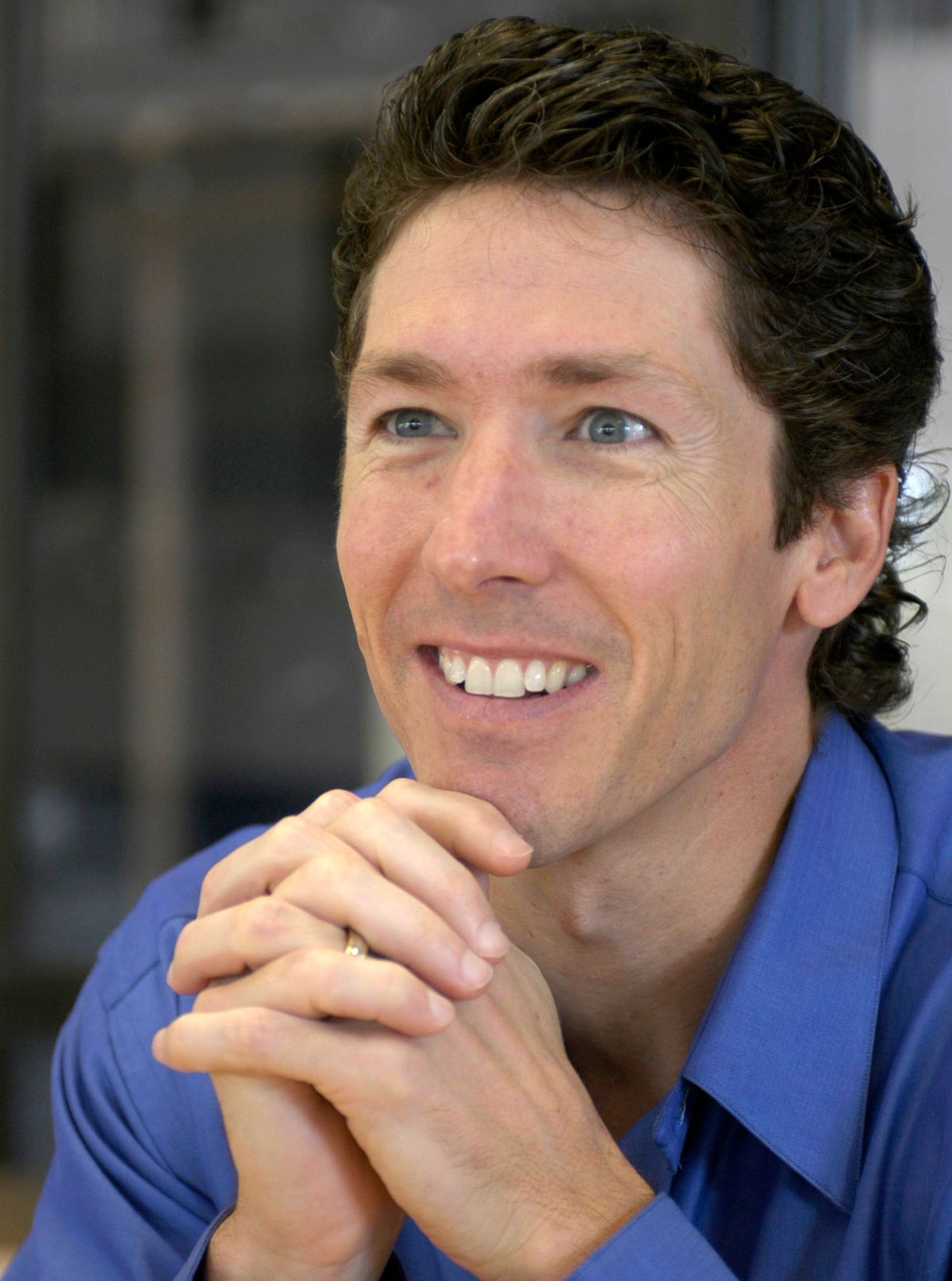 FILE - Lakewood Church pastor Joel Osteen smiles during an interview in the former basketball arena that has become the new home for the church in Houston, in this  Sept. 20, 2004, file photo. Authorities are investigating after $600,000 in checks and cash was stolen from a safe at Pastor Joel Osteen's Houston megachurch, which has one of the largest congregations in the country. Police spokesman Kese Smith said Tuesday March 11, 2014 $200,000 in cash and $400,000 in checks were stolen from a safe sometime between 2:30 p.m. Sunday and 8:30 a.m. Monday. (AP Photo/Pat Sullivan) (AP Photo/Pat Sullivan)