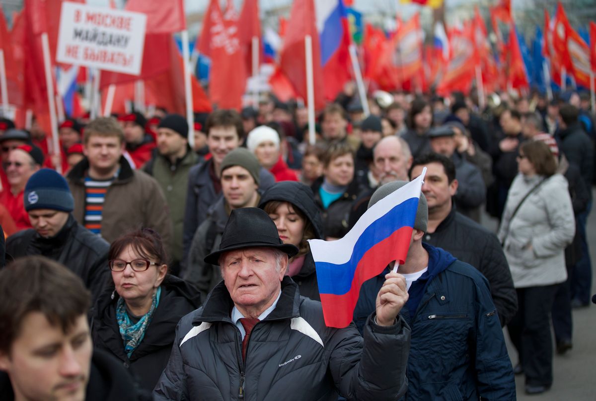 Demonstrators march in Moscow, Saturday, March 15, 2014.  (AP Photo/Alexander Zemlianichenko) 