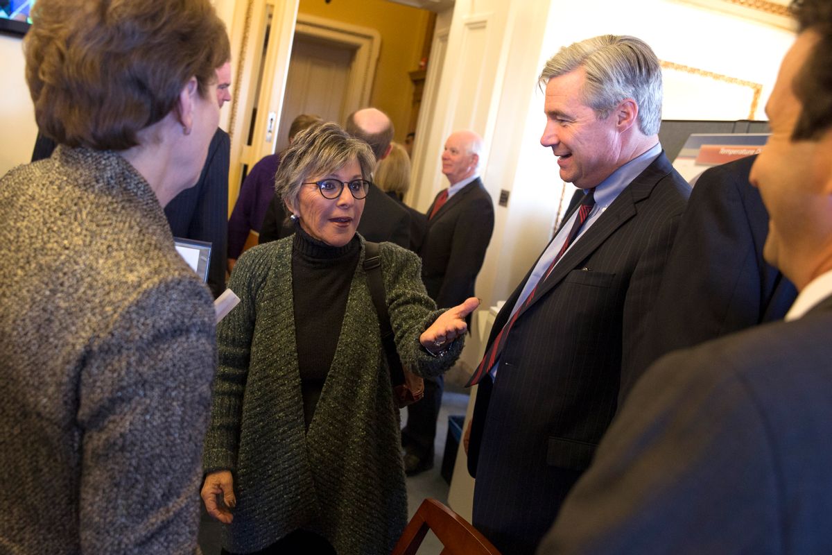 Senate Environment and Public Works Committee Chairman Sen. Barbara Boxer, D-Calif., talks with Senators during a meeting of the Senate Climate Action Task Force prior to taking to the Senate Floor all night to urge action on climate change on Capitol Hill on Monday, March 10, 2014, in Washington. From left, Sen. Jeanne Shaheen, D-N.H, Boxer, Sen. Sheldon Whitehouse, D-R.I., and Sen. Brian Schatz, D-Hawaii. (AP Photo/ Evan Vucci)  