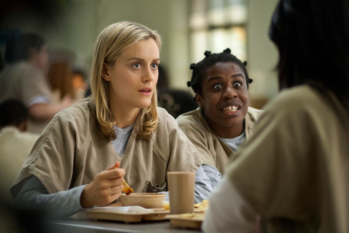 FILE - This image released by Netflix shows Taylor Schilling, left, and Uzo Aduba in a scene from "Orange Is the New Black." Season two debuts on Netflix on June 6, 2014. (AP Photo/Netflix, Paul Schiraldi, file)  (AP)