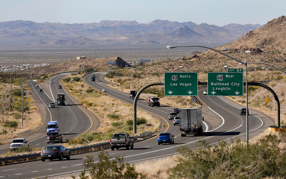 In this Friday, Nov. 8, 2013 photo, motorists head northbound toward Las Vegas on U.S. Highway 93, near Kingman, Ariz. Supporters of proposals to build an interstate highway connecting Phoenix and Las Vegas say an interstate would create a Los Angeles-Phoenix-Las Vegas megaregion and open a trade route from Mexico to Pacific Ocean ports and Canada. (AP Photo/Julie Jacobson) (AP)