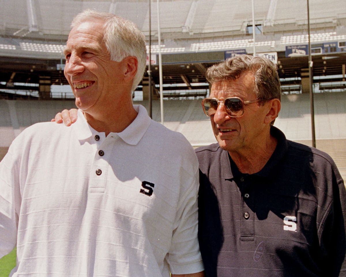 Penn State head football coach Joe Paterno, right, poses with his defensive coordinator Jerry Sandusky   (AP)