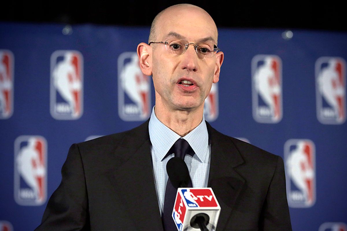 Adam Silver reads a statement during a news conference, in New York, April 29, 2014, announcing that he is banning Los Angeles Clipper owner Donald Sterling for life from the Clippers organization.     (AP/Richard Drew)