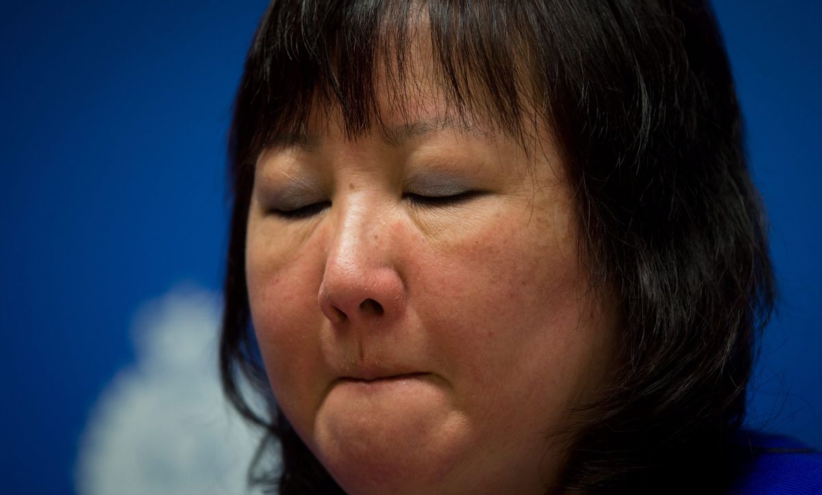 Carol Todd fights back tears as she listens during a Royal Canadian Mounted Police news conference in Surrey, British Columbia, on Thursday, April 17, 2014. A 35-year-old man alleged to be involved with the online extortion of Todd's 15-year-old daughter, who committed suicide in 2012, has been arrested in the Netherlands. (AP Photo/The Canadian Press, Darryl Dyck) (AP)