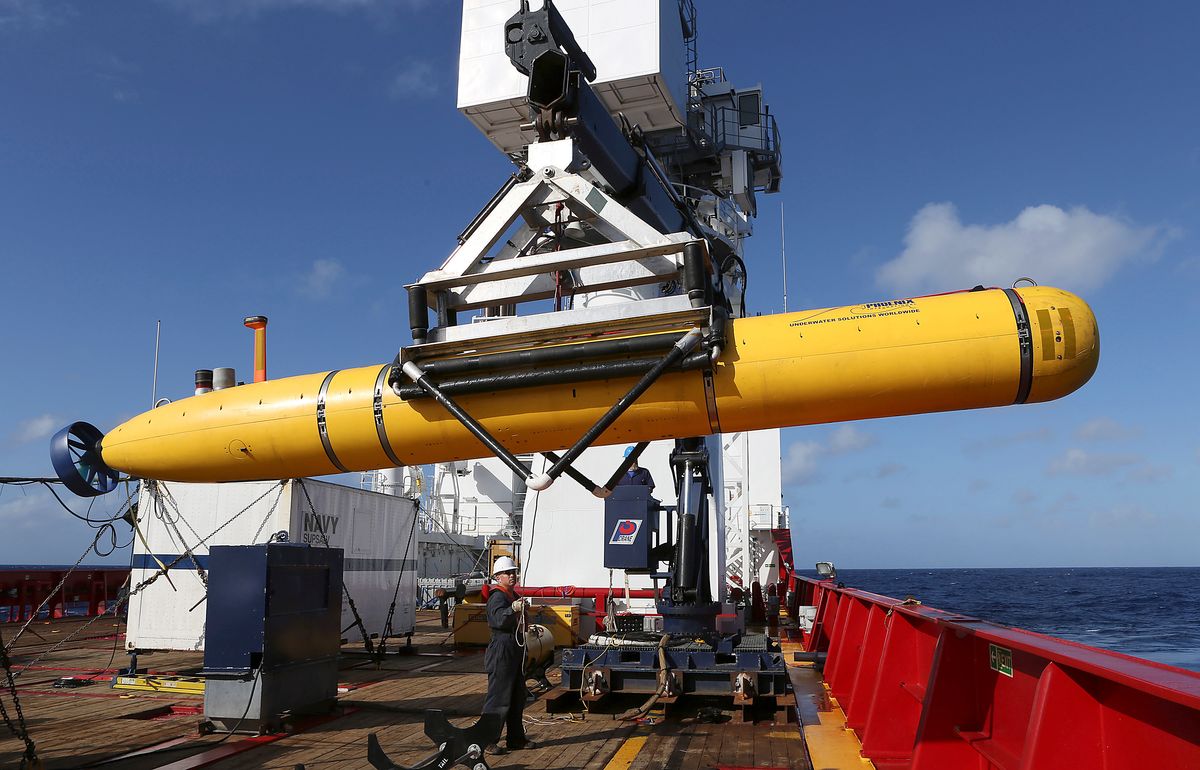 In this Thursday, April 17, 2014 photo provided by the Australian Defence Force the Phoenix International Autonomous Underwater Vehicle (AUV) Artemis is craned over the side of Australian Defence Vessel Ocean Shield before launching the vehicle in to the southern Indian Ocean in the search of the missing Malaysia Airlines Flight 370Malaysia Airlines MH370. Up to 11 aircraft and 12 ships continue to scan the ocean surface for debris from the Boeing 777 that disappeared March 8 en route from Kuala Lumpur to Beijing with 239 people on board. (AP Photo/Australian Defence Force, Bradley Darvill) EDITORIAL USE ONLY    (Lsis Bradley Darvill)