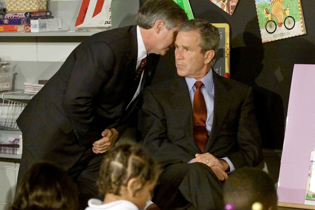 Andrew Card informs George W. Bush of a second plane hitting the World Trade Center, at the Emma E. Booker Elementary School in Sarasota, Florida, September 11, 2001.                (Reuters/Win McNamee)