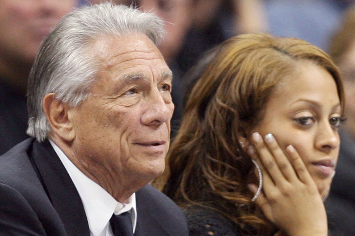 Donald Sterling watches his team beat the Denver Nuggets in Denver on April 29, 2006. LaLa Vasquez, right,  fiancee of Nuggets forward Carmelo Anthony, reacts as time runs out in the game.                 (AP/David Zalubowski)
