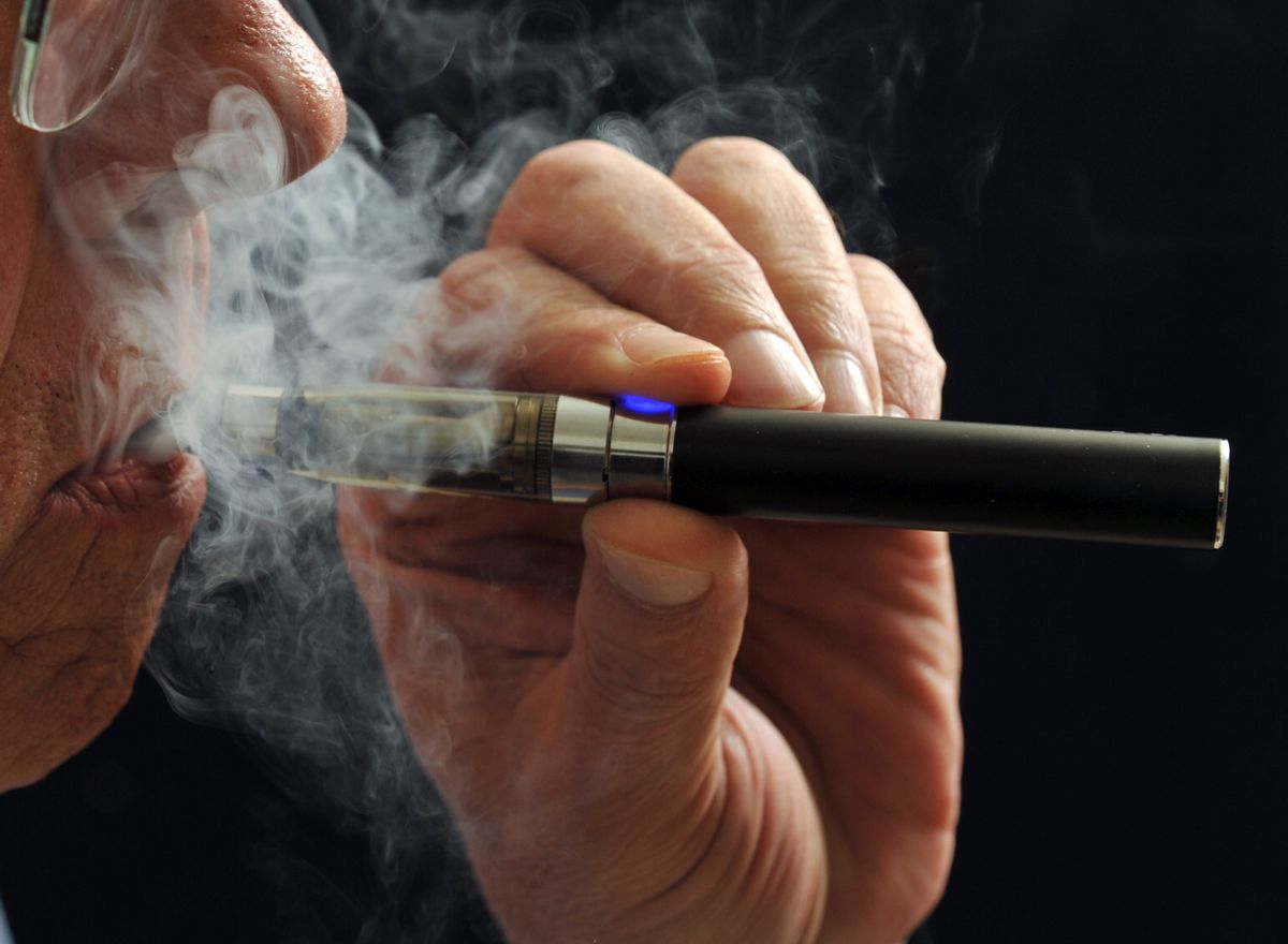 In this Jan. 17, 2014 photo, a smoker demonstrates an e-cigarette in Wichita Falls, Texas. ((AP Photo/Wichita Falls Times Record News, Torin Halsey))