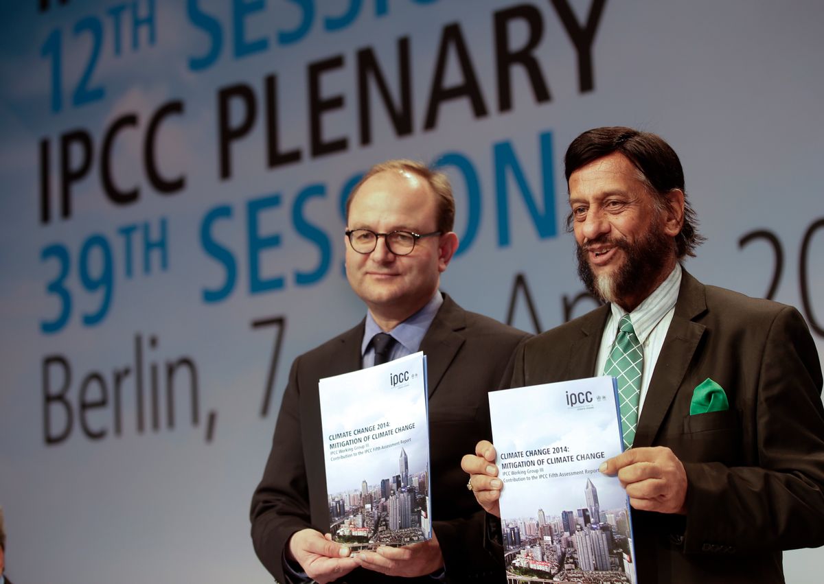 Ottmar Edenhofer, Co-Chairman of the IPCC Working Group III, and Rejendra K. Pachauri, Chairman of the IPCC, from left, pose prior to a press conference as part of a meeting of the Intergovernmental Panel on Climate Change (IPCC) in Berlin, Germany, Sunday, April 13, 2014.   (AP/Michael Sohn)