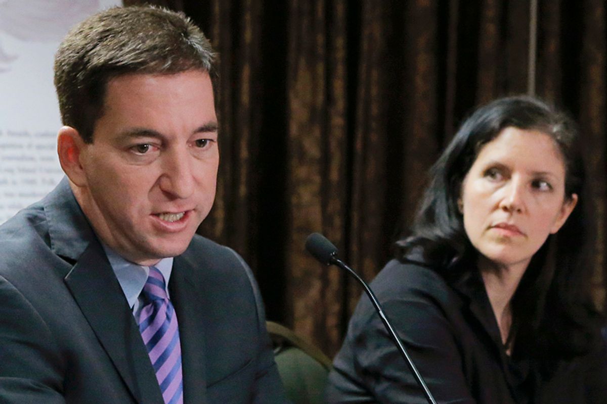 Glenn Greenwald, Laura Poitras            (Reuters/Eduardo Munoz)