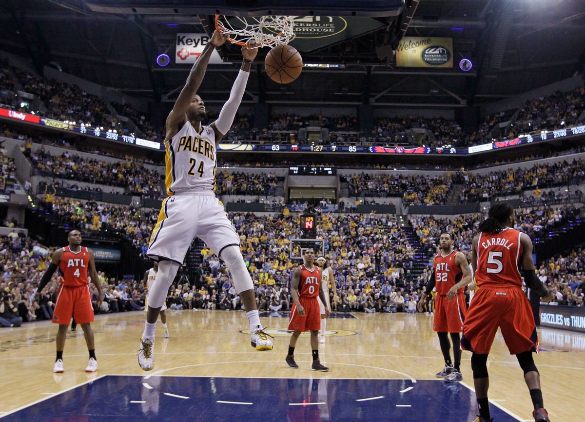 Indiana Pacers' Paul George (24) dunks during the second half in Game 5 of an opening-round NBA basketball playoff series against the Atlanta Hawks Monday, April 28, 2014, in Indianapolis. Atlanta defeated Indiana 107-97. (AP Photo/Darron Cummings) (AP)
