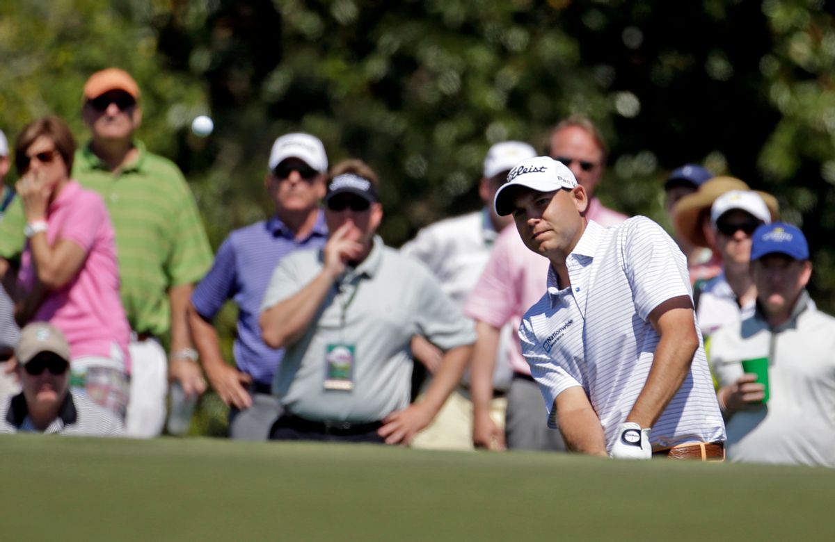 Bill Haas watches his chip shot to the 17th green during the first round of the Masters golf tournament Thursday, April 10, 2014, in Augusta, Ga. (AP Photo/Darron Cummings) (Darron Cummings)