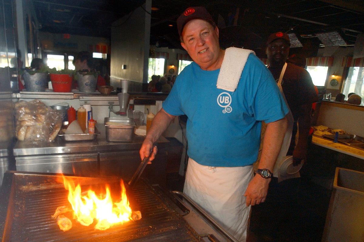 FILE - In this June 23, 2006 file photo, Uncle Bubba's Oyster House chef and owner Bubba Hiers, who is also Paula Deen's brother, grills oysters at the Savannah, Ga. restaurant. The wildly popular Georgia restaurant at the center of a lawsuit that left the reputation of famed Southern celebrity cook Paula Deen in shambles has reportedly closed. The Savannah Morning News and WSAV television both reported Thursday April 3, 2014 that Uncle Bubba's Seafood &amp; Oyster House announced the closure on its Facebook page.  (AP Photo/Stephen Morton, File) (AP)