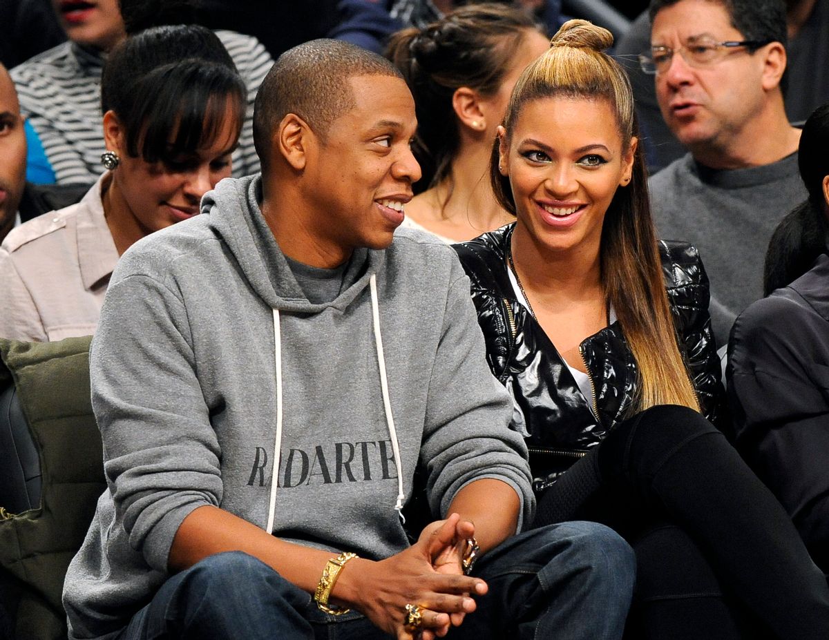 FILE - This Nov. 23, 2012 file photo shows entertainers Jay Z and his wife Beyonce at the Brooklyn Nets against the Los Angeles Clippers NBA basketball game at Barclays Center in New York. The couple will launch the co-headlining "On the Run Tour" on June 25 in Miami. (AP Photo/Kathy Kmonicek, File)   (AP)
