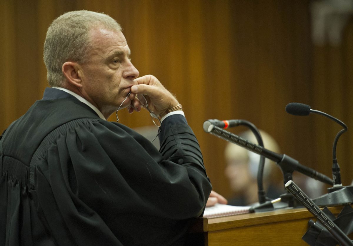 State prosecutor, Gerrie Nel, questions Oscar Pistorius in court in Pretoria, South Africa,  Friday, April 11, 2014. Pistorius is charged with the murder of his girlfriend Reeva Steenkamp, on Valentines Day in 2013. (AP Photo/Craig Nieuwenhuizen, Pool) (AP)
