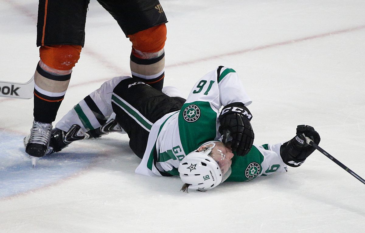 Dallas Stars' Ryan Garbutt falls to the ice after he was checked by Anaheim Ducks' Bryan Allen during the third period in Game 1 of the first-round NHL hockey Stanley Cup playoff series on Wednesday, April 16, 2014, in Anaheim, Calif. The Ducks won 4-3. (AP Photo/Jae C. Hong) (AP)