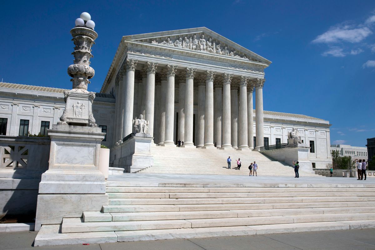 People walk on the steps of the U.S. Supreme Court in Washington on Saturday April 26, 2014.  ((AP Photo/Jacquelyn Martin))