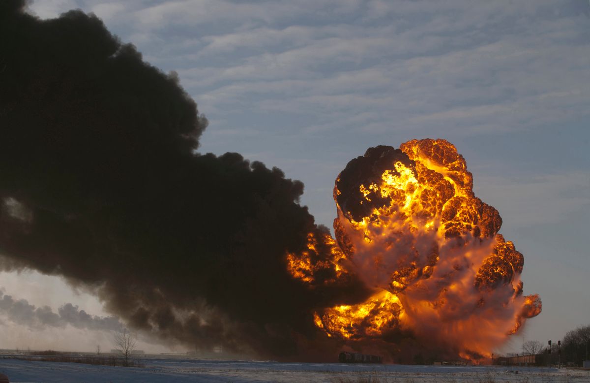 This Dec. 30, 2013 file photo shows a fireball going up at the site of an oil train derailment in Casselton, N.D. (AP Photo/Bruce Crummy, File)   