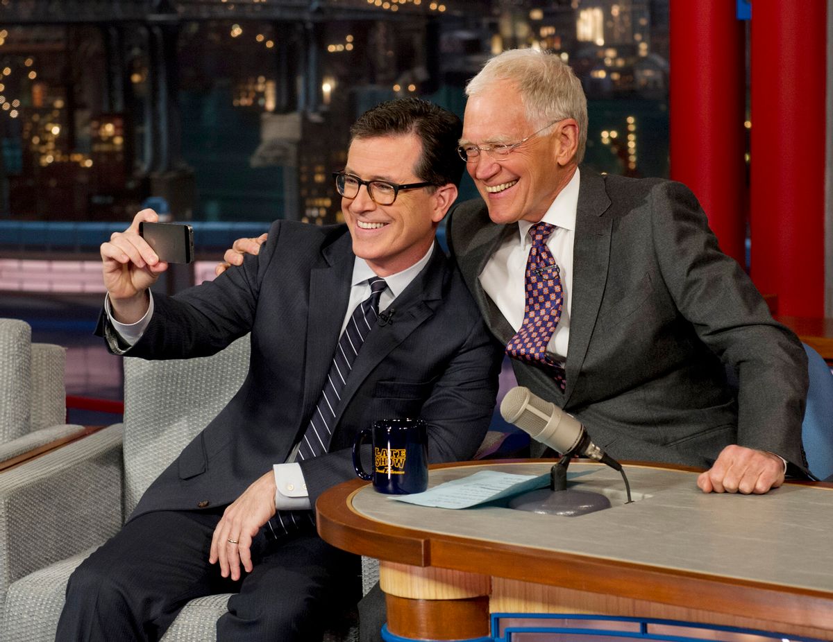 In this photo provided by CBS, Comedy Centrals Stephen Colbert, left, takes a selfie with host David Letterman on the set of the Late Show with David Letterman, Tuesday, April 22, 2014 in New York. This was Colberts first visit to the show since CBS announced that he will succeed Letterman as host when he retires in 2015. (AP Photo/Jeffrey R. Staab) MANDATORY CREDIT, NO SALES, NO ARCHIVE, FOR NORTH AMERICAN USE ONLY     (AP)