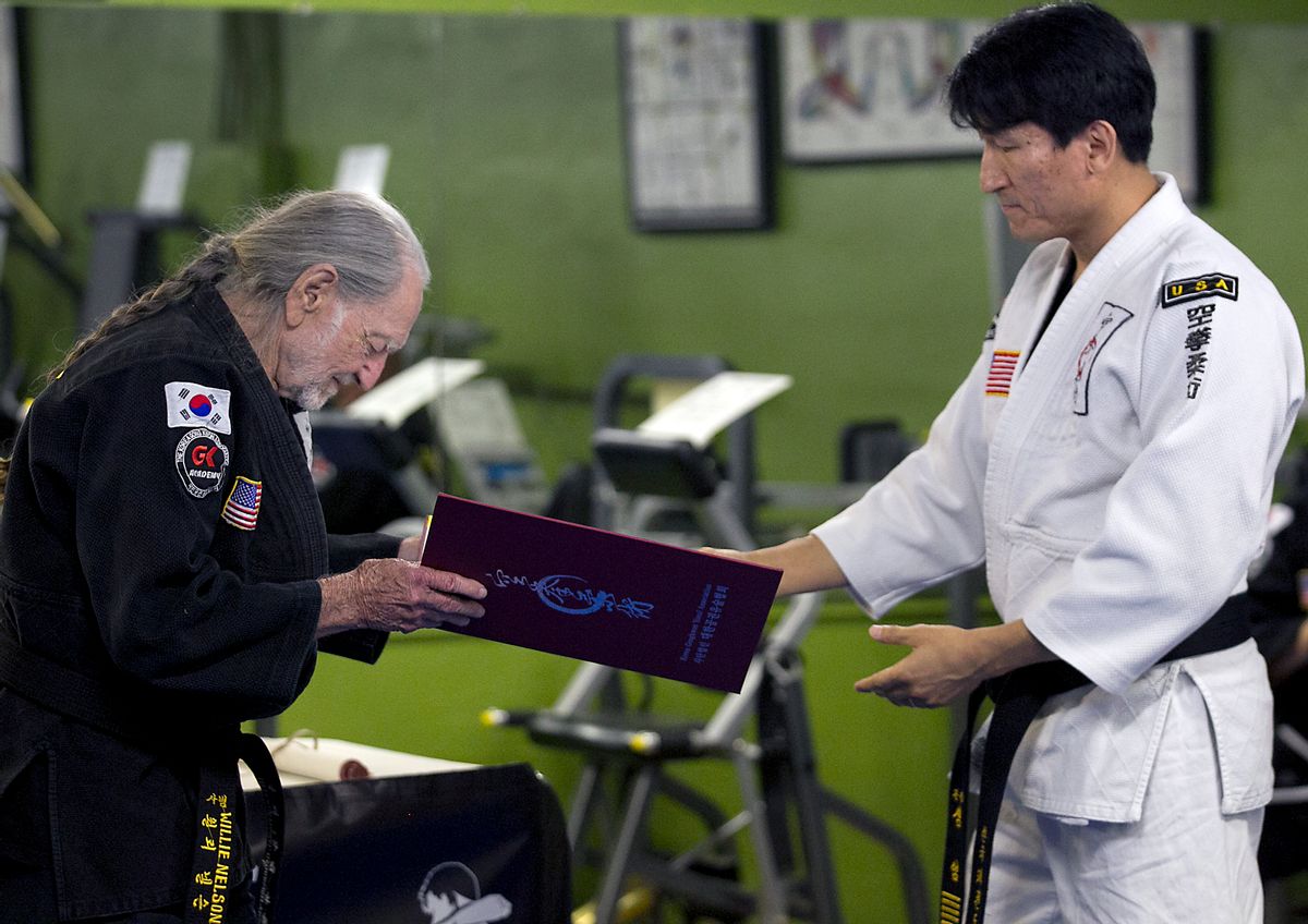 Willie Nelson, the country music icon who turns 81 this week, bows as he receives his fifth-degree black belt in the martial art of Gong Kwon Yu Sul on Monday, April 28, 2014, in Austin, Texas.  (AP Photo/Austin American-Statesman, Ralph Barrera)  AUSTIN CHRONICLE OUT, COMMUNITY IMPACT OUT, INTERNET AND TV MUST CREDIT PHOTOGRAPHER AND STATESMAN.COM, MAGS OUT (AP)