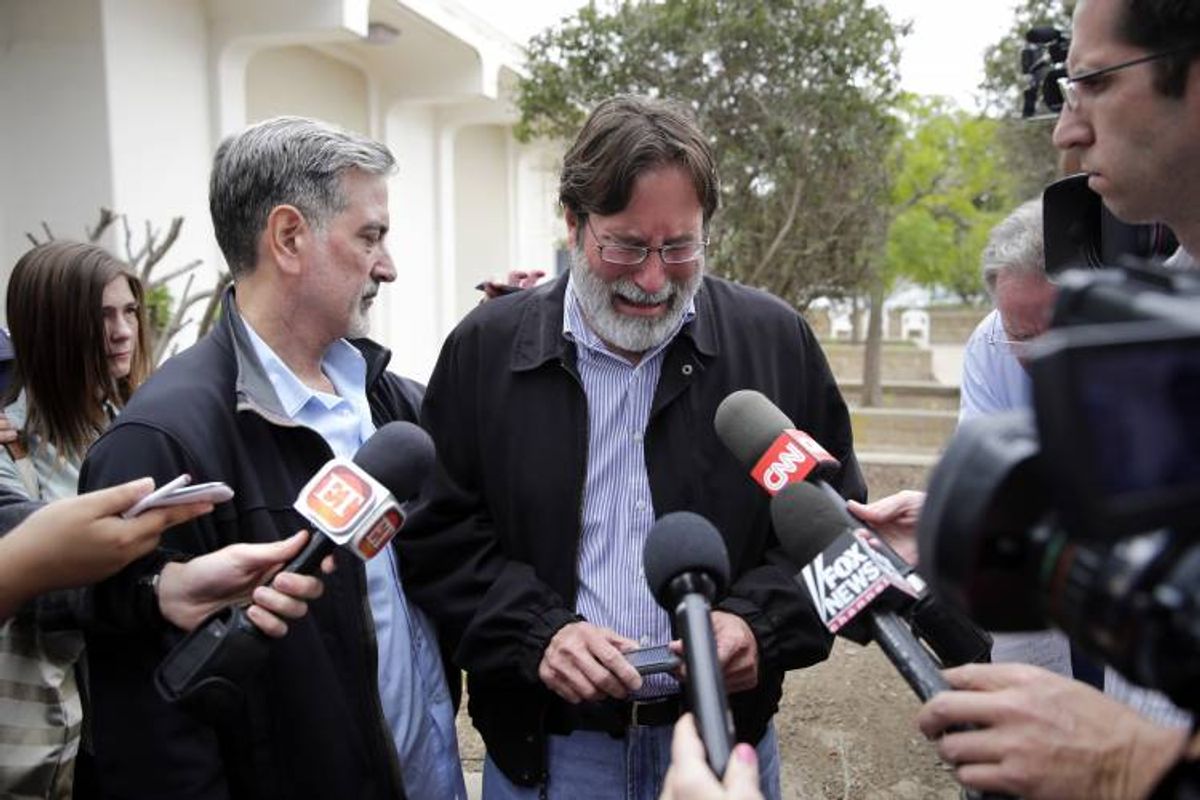 Richard Martinez, center, who says his son Christopher Martinez was killed in Friday night's mass shooting that took place in Isla Vista, Calif. (AP Photo/Jae C. Hong)        (AP)