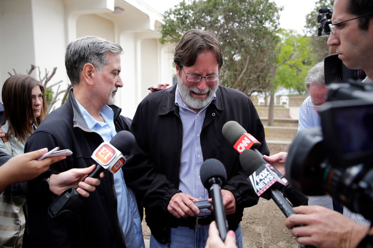 Richard Martinez, center, who says his son Christopher Martinez was killed in Friday night's mass shooting that took place in Isla Vista, Calif., is comforted by his brother, Alan, as he talks to media outside the Santa Barbara County Sheriff's Headquarters on Saturday, May 24, 2014, in Santa Barbara, Calif. (AP Photo/Jae C. Hong) (AP)