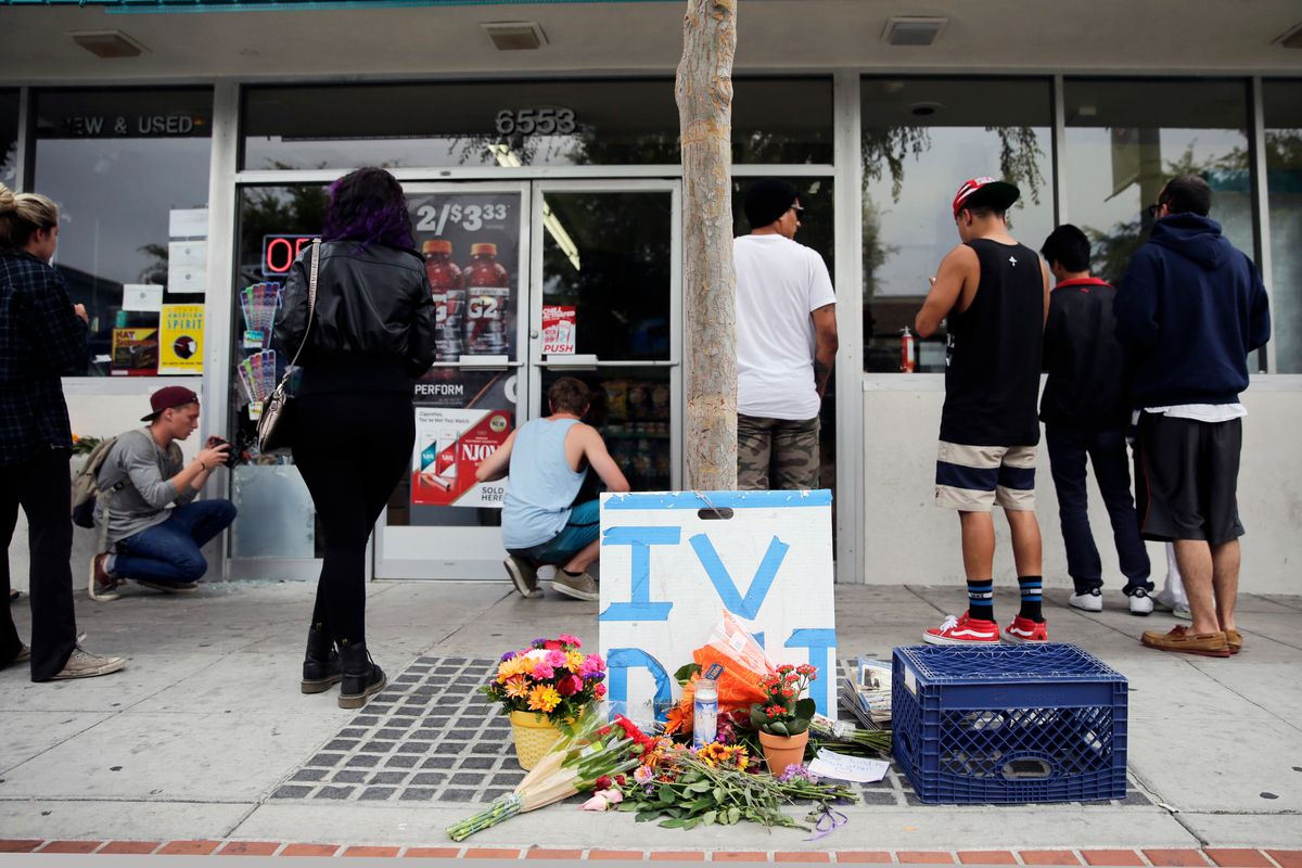 Some flowers are left in front of IV Deli Mart, where part of Friday night's mass shooting took place by a drive-by shooter, on Saturday, May 24, 2014, in Isla Vista, Calif. Alan Shifman, a lawyer who represents Hollywood director Peter Rodger, says the family believes Rodgers son, Elliot Rodger, was the lone gunman who went on the shooting rampage near the University of California at Santa Barbara.   ((AP Photo/Jae C. Hong))