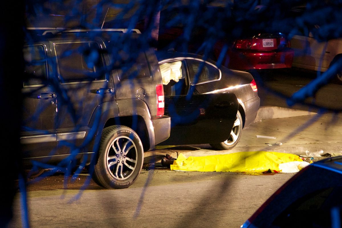 This photo shows the scene of a drive-by shooting that left seven people dead, including the attacker, and others wounded on Friday, May 23, 2014, in Isla Vista, Calif. Alan Shifman an attorney for Hollywood director Peter Rodger, who was an assistant director on The Hunger Games, said the family believes Rodger's son, Elliot Rodger, is responsible for the shooting rampage near the Santa Barbara, California, university campus. Authorities have not confirmed the identity of the shooter.  ((AP Photo/The News-Press, Peter Vandenbelt))