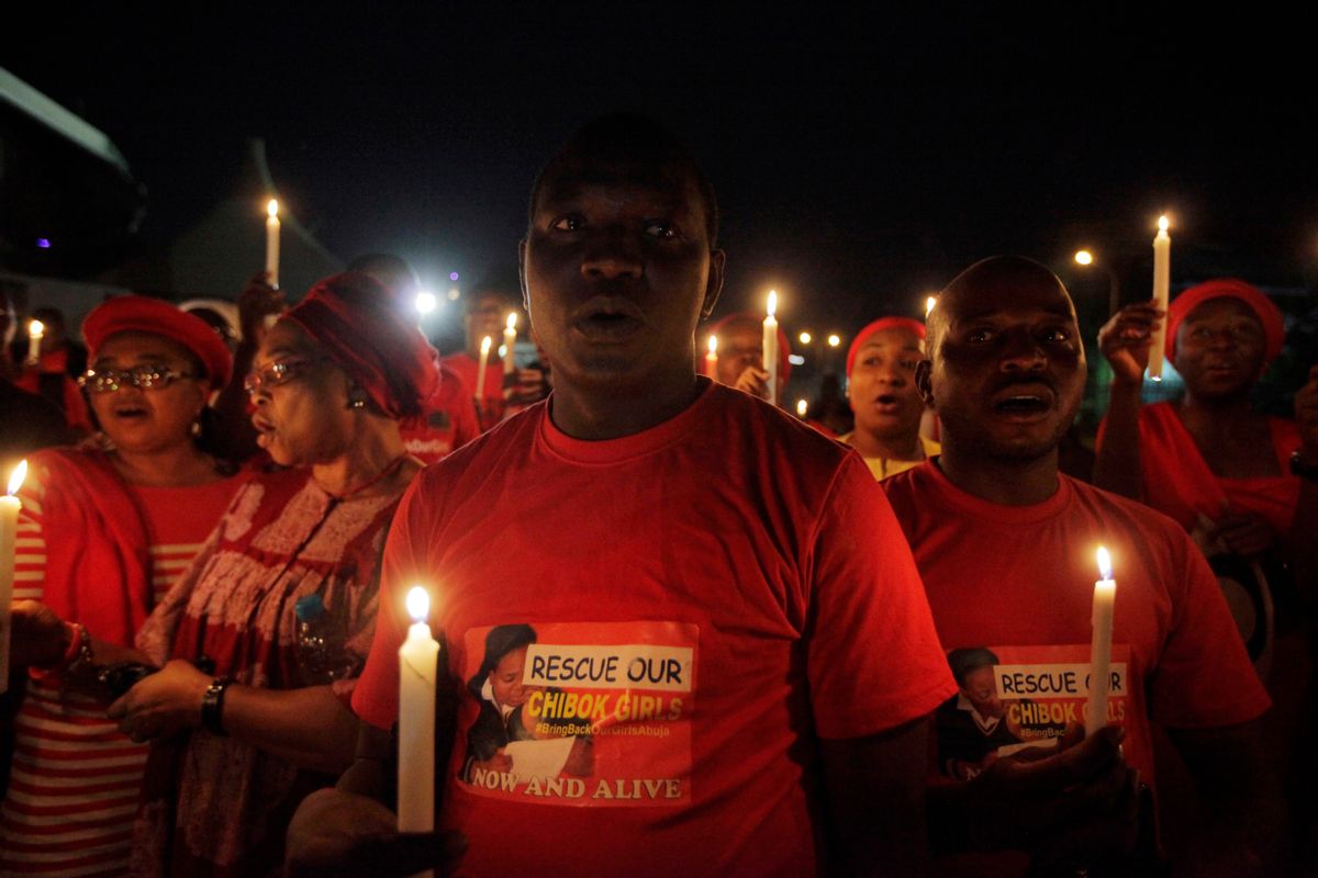 Men and Women hold candle light  during a vigil to mark thirty days since the girls of Government secondary school Chibok  were Kidnapped in Abuja, Nigeria, Wednesday, May 14, 2014. Nigeria's government is ruling out an exchange of more than 270 kidnapped schoolgirls for detained Islamic militants, Britain's top official for Africa said Wednesday.
President Goodluck Jonathan has "made it very clear that there will be no negotiation with Boko Haram that involves a swap of abducted schoolgirls for prisoners," Mark Simmonds, British foreign office minister, told journalists in the Nigerian capital, Abuja. (AP Photo/Sunday Alamba) (Sunday Alamba)