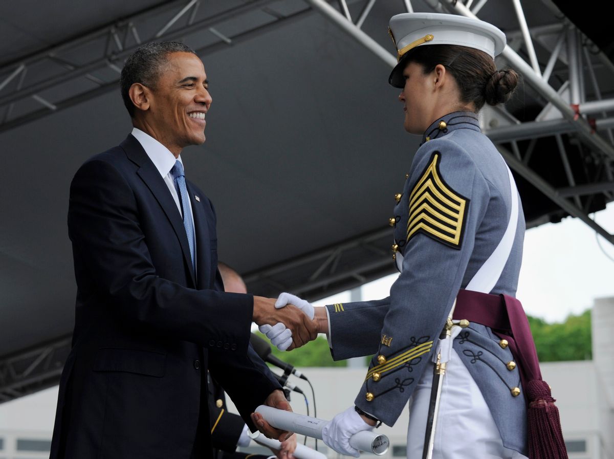 President Barack Obama hands out diploma to class valedictorian Erin Maudlin from Albuquerque, N.M., during the commencement ceremony for the U.S. Military Academy at West Point's Class of 2014, in West Point, N.Y., Wednesday, May 28, 2014. Obama talked about his Afghanistan plan and answered critics who say he has surrendered America's global leadership. (AP Photo/Susan Walsh) (AP)