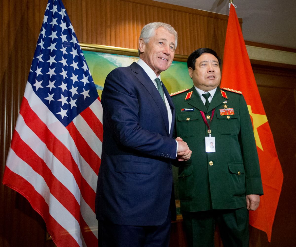 U.S. Defense Secretary Chuck Hagel, left, meets with Vietnam's Defense Minister Phung Quang Thanh, right, before the start of their meeting, Saturday, May 31, 2014 in Singapore. Hagel traveled to Singapore to attend the 13th Asia Security Summit. (AP Photo/Pablo Martinez Monsivais, Pool) (AP)