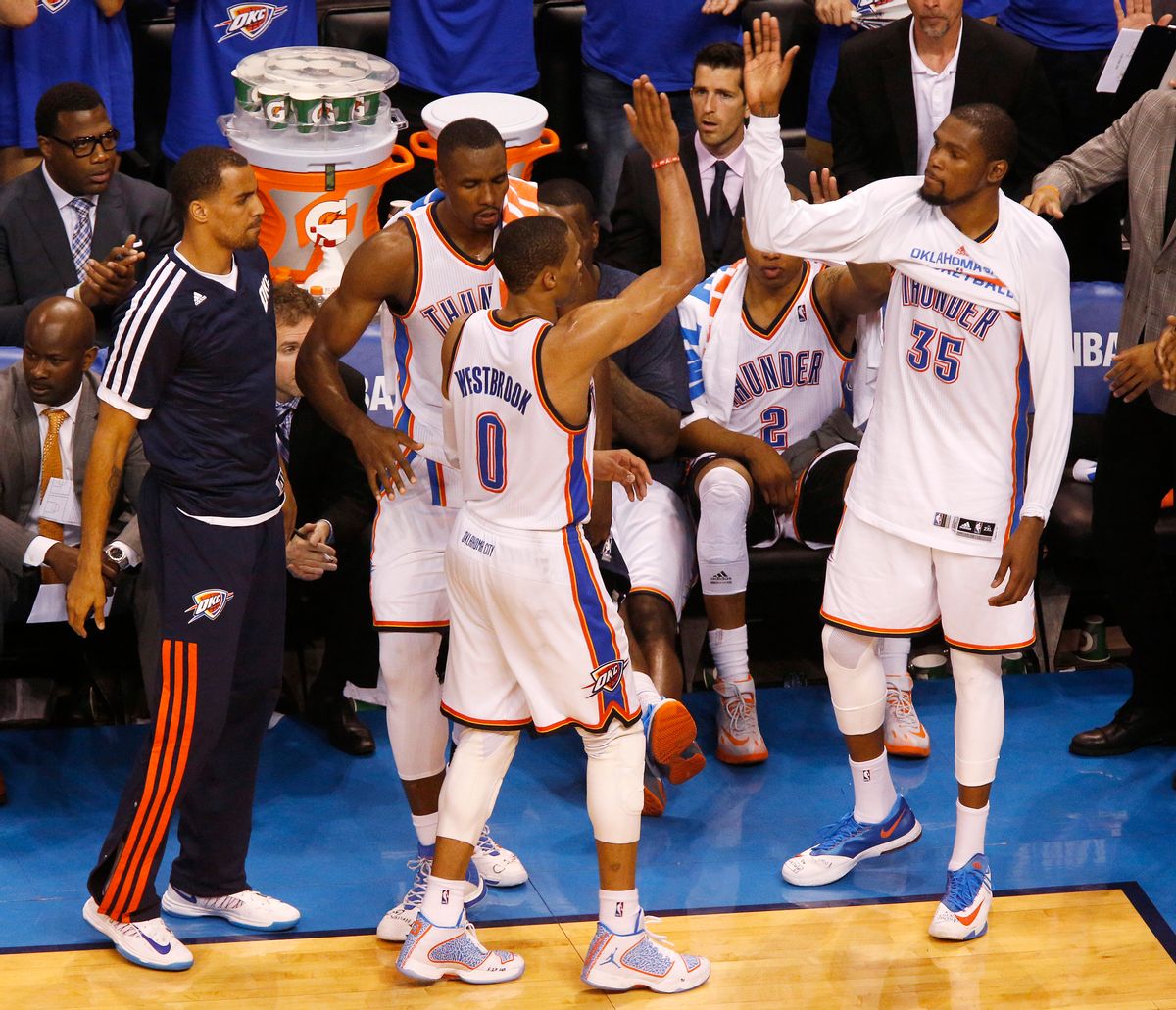 Oklahoma City Thunder guard Russell Westbrook (0) is greeted by teammates, guard Thabo Sefolosha (25), forward Serge Ibaka (9), and forward Kevin Durant (35) after being pulled in the last moments of Game 4 of the Western Conference finals NBA basketball playoff series in Oklahoma City, Tuesday, May 27, 2014. (AP Photo/Garett Fisbeck) (AP)
