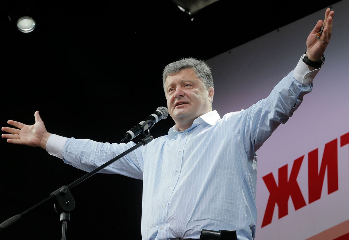 Ukrainian presidential candidate Petro Poroshenko speaks to supporters during a rally  in Uman, Ukraine, Tuesday, May 20, 2014. Presidential vote in Ukraine is scheduled for May 25. Ukraine is holding a presidential election Sunday but it has become downright dangerous for many in the east to be associated with the vote, since the eastern regions of Donetsk and Luhansk declared independence last week. Ukrainian police and election officials accuse pro-Russia gunmen there of seizing election commission offices and threatening members in an effort to derail the presidential vote.  ((AP Photo/Efrem Lukatsky))