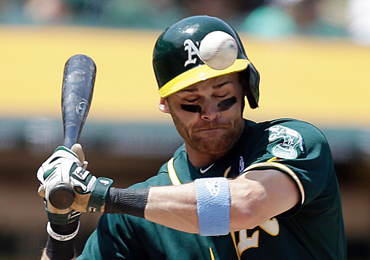 10ThingstoSeeSports - Oakland Athletics' Craig Gentry is hit on the helmet by a pitch thrown by New York Yankees' Jose Ramirez in the fourth inning of a baseball game on Sunday, June 15, 2014, in Oakland, Calif. (AP Photo/Ben Margot, File) (AP)