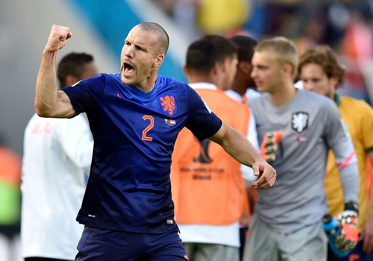 Netherlands' Ron Vlaar celebrates after the group B World Cup soccer match between Australia and the Netherlands at the Estadio Beira-Rio in Porto Alegre, Brazil, Wednesday, June 18, 2014.  The Netherlands won the match 3-2.    (AP Photo/Martin Meissner) (Martin Meissner)