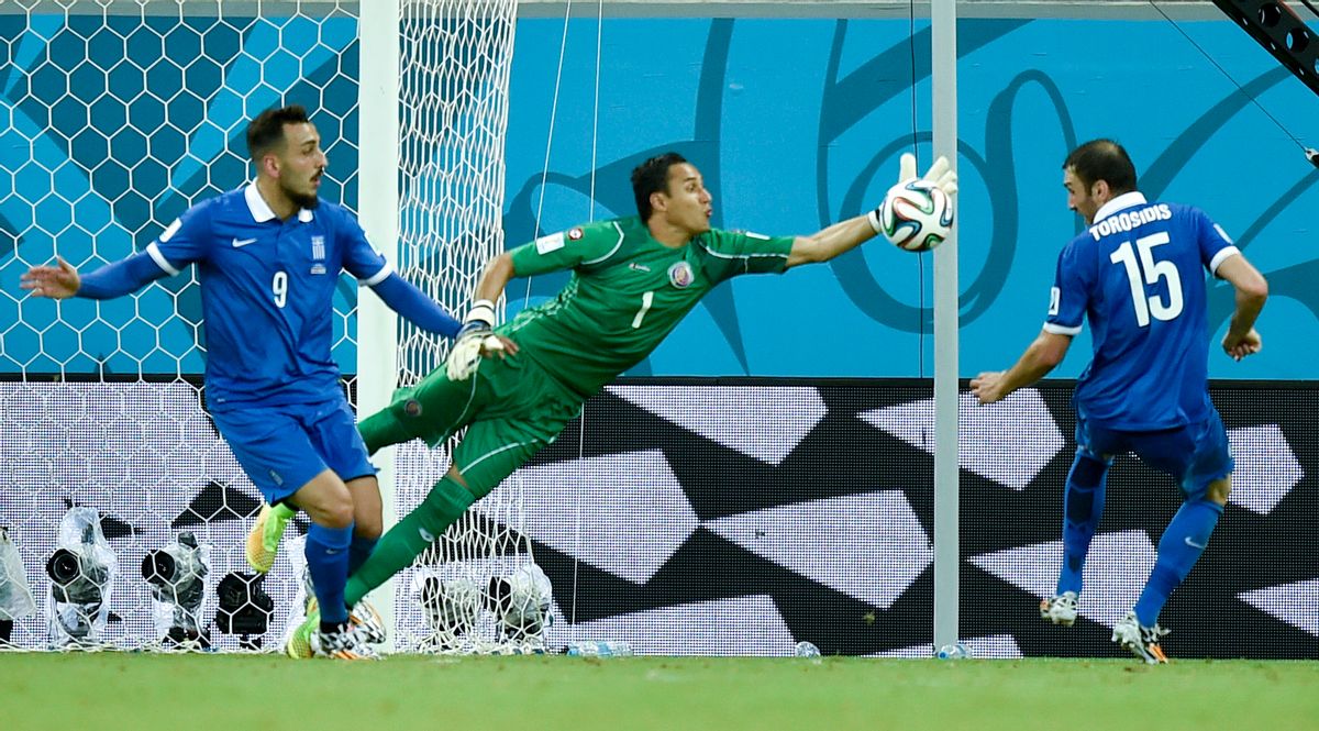 Costa Rica's goalkeeper Keylor Navas clears the ball away from Greece's Kostas Mitroglou (9) and Vasilis Torosidis during the World Cup round of 16 soccer match between Costa Rica and Greece at the Arena Pernambuco in Recife, Brazil, Sunday, June 29, 2014. (AP Photo/Martin Meissner) (Martin Meissner)