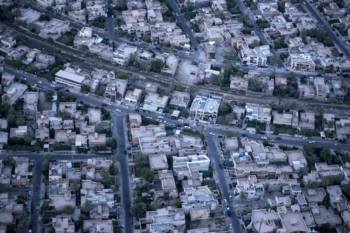 A photo taken on board a helicopter shows parts of the Iraqi capital Baghdad Monday, June 23, 2014 as US Secretary of State John Kerry pledged during a visit to the capital, "intense" support for Iraq against the "existential threat" of a major militant offensive pushing toward Baghdad from the north and west.  (AP Photo/Brendan Smialowski, Pool) (AP)
