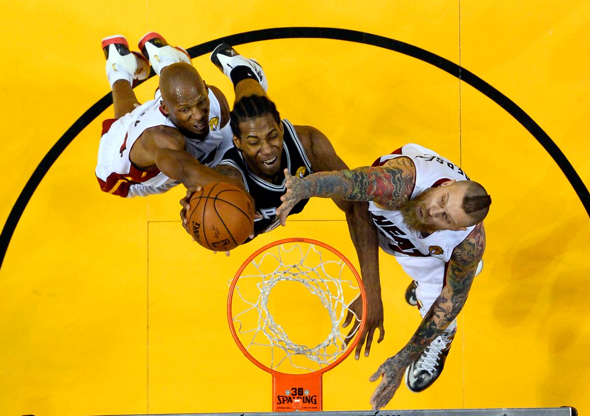 Miami Heat guard Ray Allen, left, and forward Chris Andersen block a shot by San Antonio Spurs forward Kawhi Leonard, center, in the second half in Game 3 of the NBA basketball finals in Miami, Tuesday, June 10, 2014. The Spurs won 111-92. (AP Photo/Larry W. Smith, Pool) (AP)