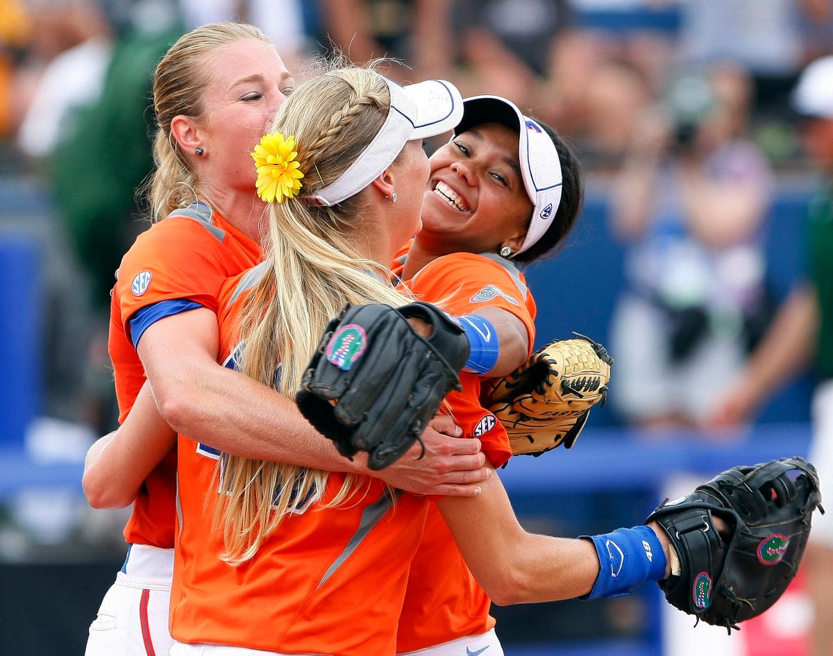 Florida pitcher Hannah Rogers, Taylor Schwarz, front, and Kelsey Stewart, right, celebrate after defeating Baylor during an NCAA women's softball College World Series tournament game, Sunday, June 1, 2014, in Oklahoma City. Florida won 6-3. (AP Photo/Alonzo Adams) (AP)