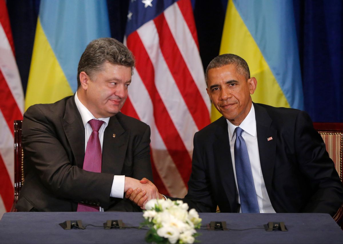 U.S. President Barack Obama, right, shakes hands with Ukraine president-elect Petro Poroshenko in Warsaw, Poland, Wednesday, June 4, 2014. (AP Photo/Charles Dharapak) (AP)
